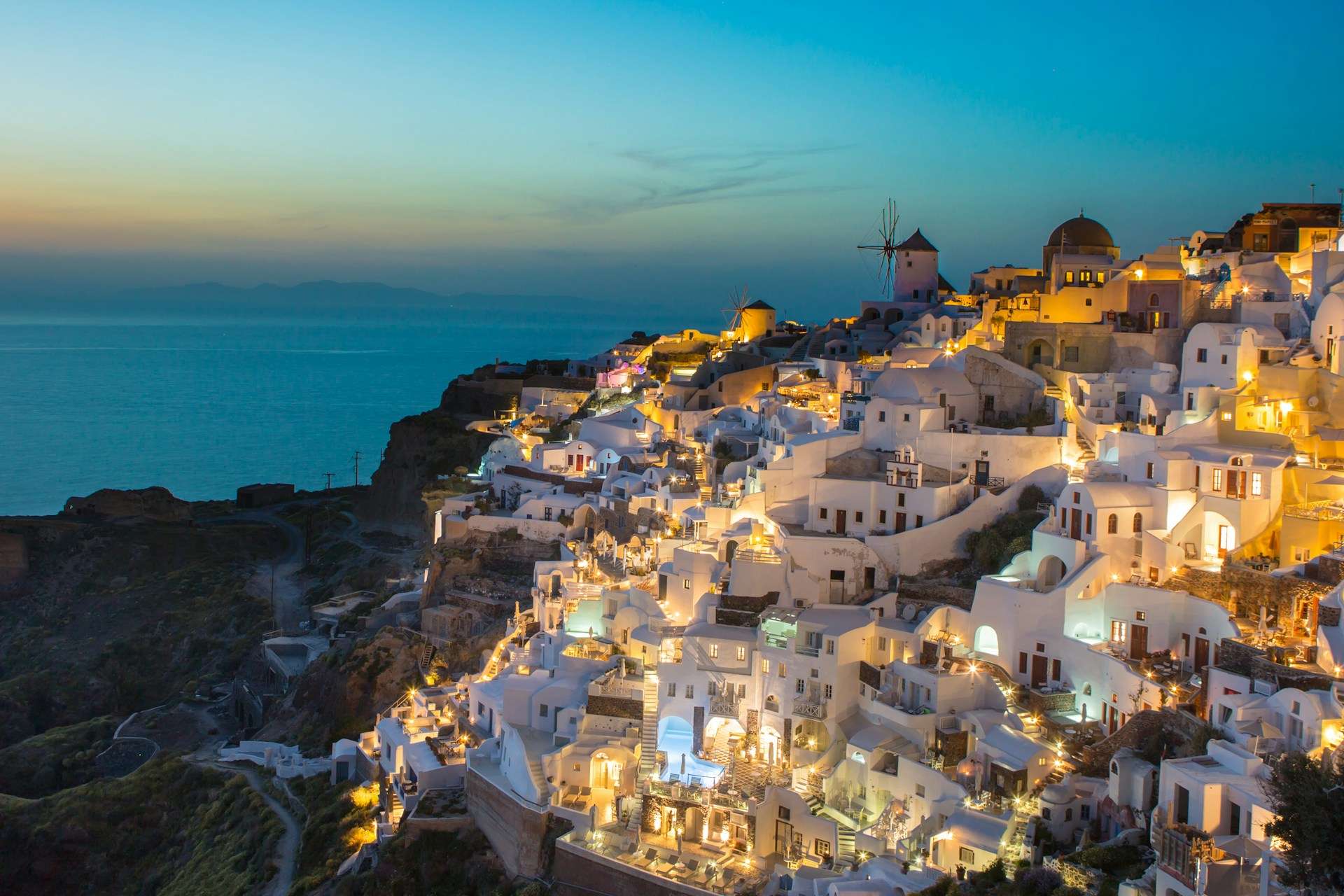 Hotels in the Cyclades — Santorini caldera views, Mykonos beach areas, Naxos and Paros island bases, ferry routes and island-hopping planning